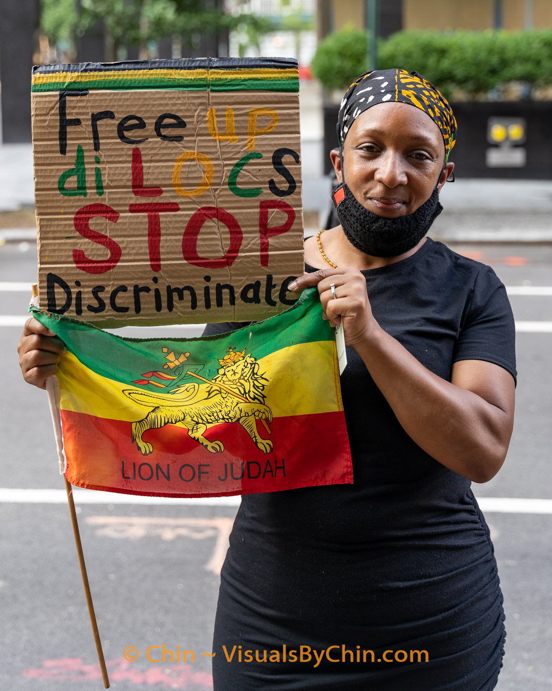 Woman holding sign and flag